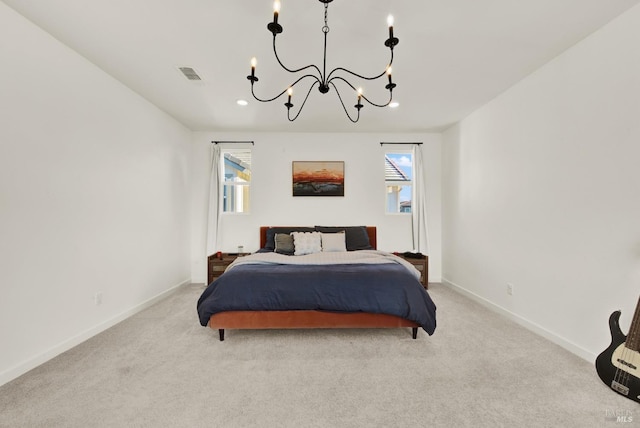 bedroom featuring light carpet and a chandelier