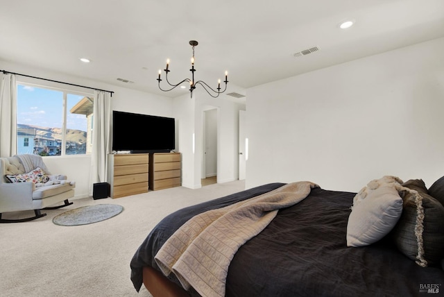 carpeted bedroom with a chandelier