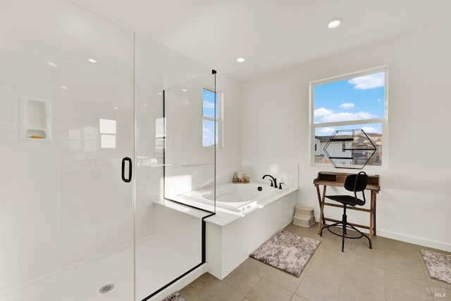 bathroom with shower with separate bathtub and tile patterned floors