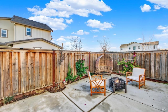 view of patio / terrace with a fire pit