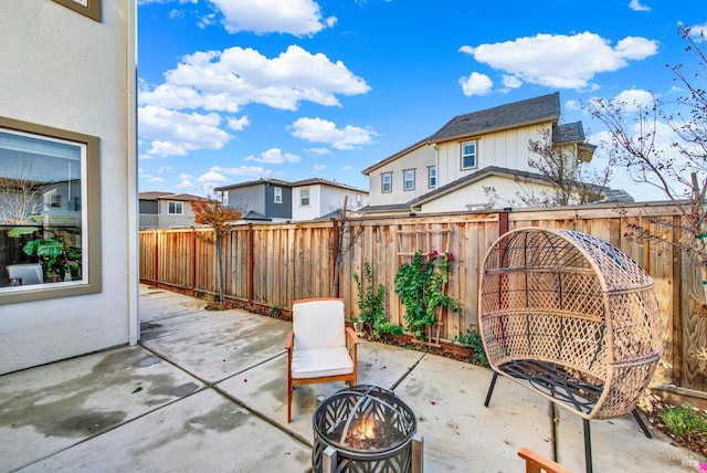 view of patio / terrace featuring an outdoor fire pit