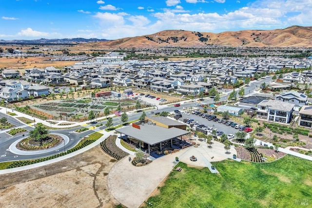 birds eye view of property with a mountain view