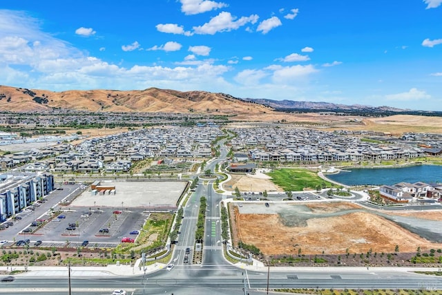 bird's eye view featuring a water and mountain view