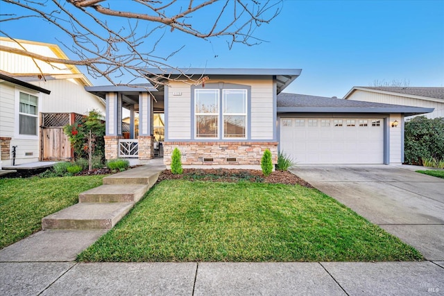 view of front facade with a front lawn and a garage