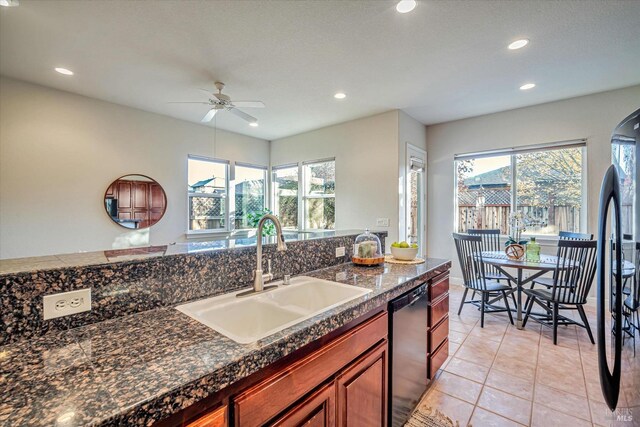 kitchen featuring black appliances, light tile patterned floors, ceiling fan, and sink