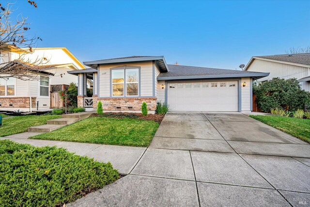 view of front facade with a front lawn and a garage