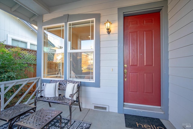 property entrance featuring a porch