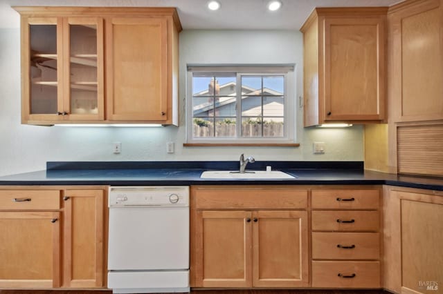 kitchen with light brown cabinets, white dishwasher, and sink