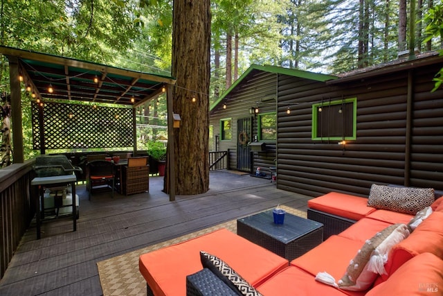 wooden deck featuring an outdoor living space