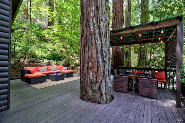 wooden deck featuring outdoor dining area and an outdoor hangout area