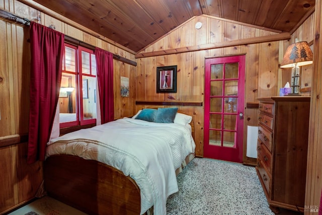 bedroom featuring lofted ceiling, wood ceiling, and wooden walls