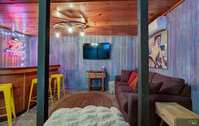 living area featuring wood walls, a wall unit AC, carpet flooring, and wood ceiling