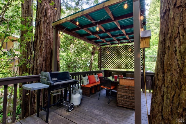 wooden deck featuring outdoor dining space