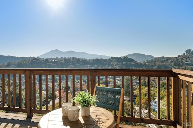 wooden deck with a mountain view