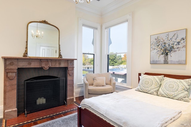 bedroom featuring a notable chandelier, crown molding, and dark wood-type flooring