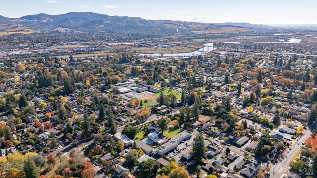 birds eye view of property featuring a mountain view