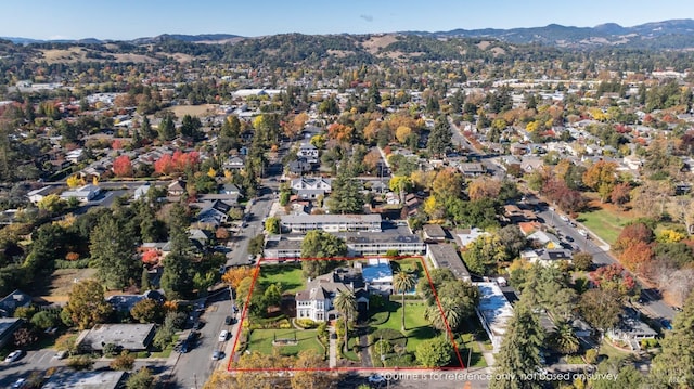 drone / aerial view featuring a mountain view