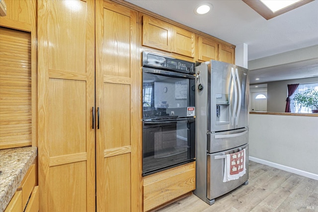 kitchen featuring dobule oven black, light wood finished floors, baseboards, stainless steel fridge with ice dispenser, and recessed lighting