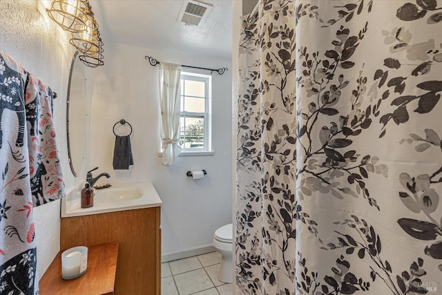 full bath featuring baseboards, visible vents, toilet, tile patterned floors, and vanity