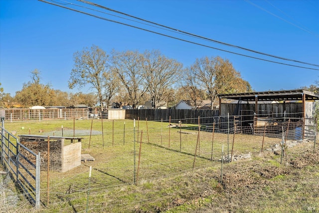 view of yard featuring an outdoor structure and an exterior structure