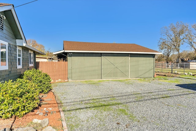 garage with fence