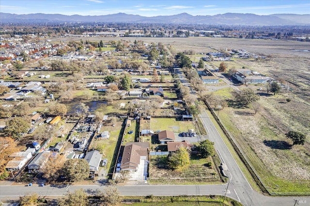 birds eye view of property featuring a mountain view