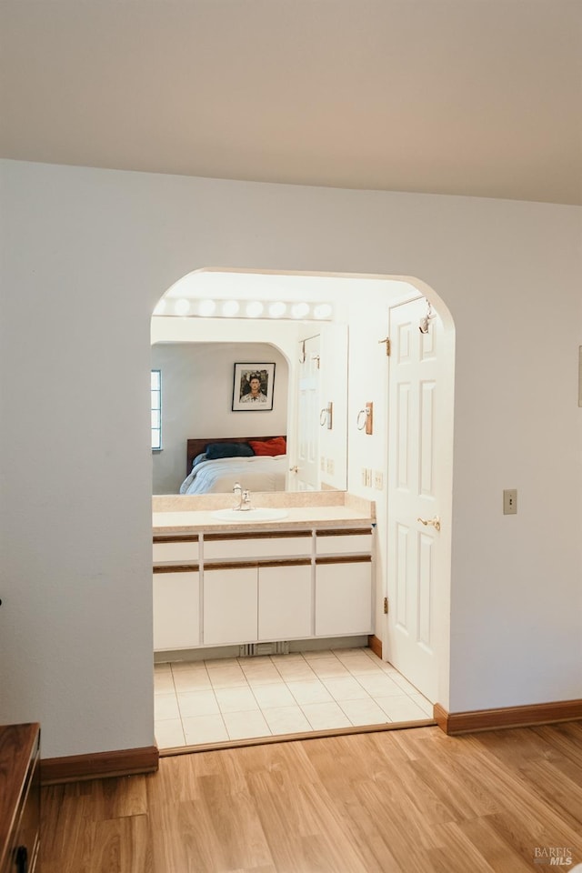 bathroom featuring vanity and hardwood / wood-style flooring