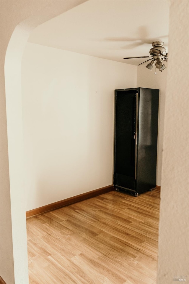 unfurnished room featuring ceiling fan and wood-type flooring