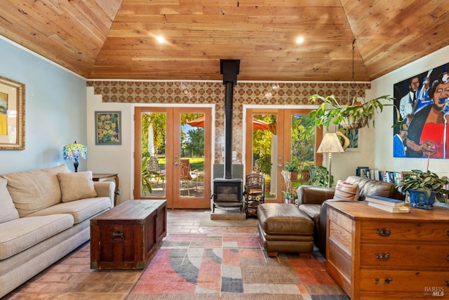 living room with a wood stove, french doors, wood ceiling, and vaulted ceiling