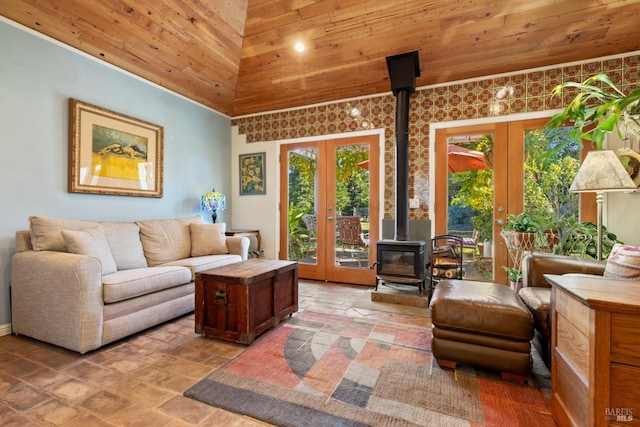 living room with french doors, a wood stove, and plenty of natural light