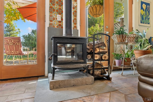 room details featuring french doors and a wood stove