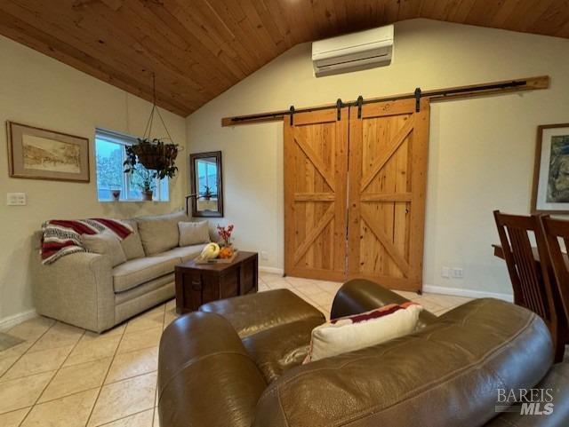 tiled living room with lofted ceiling, a barn door, an AC wall unit, and wooden ceiling