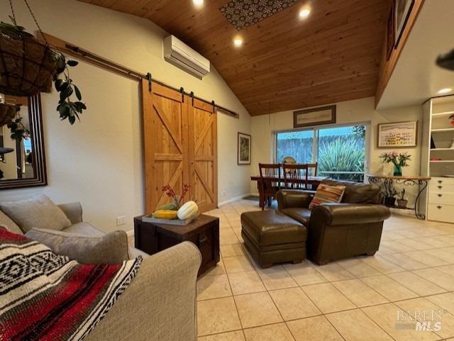 tiled living room featuring wood ceiling, a barn door, an AC wall unit, and high vaulted ceiling