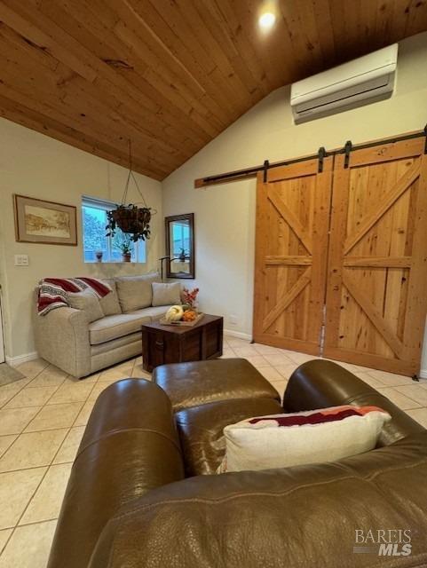 living room with wooden ceiling, a wall mounted air conditioner, a barn door, lofted ceiling, and light tile patterned flooring