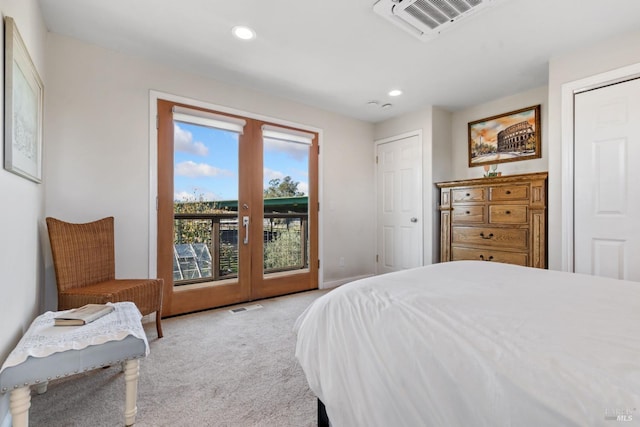 bedroom featuring access to exterior, light carpet, and french doors