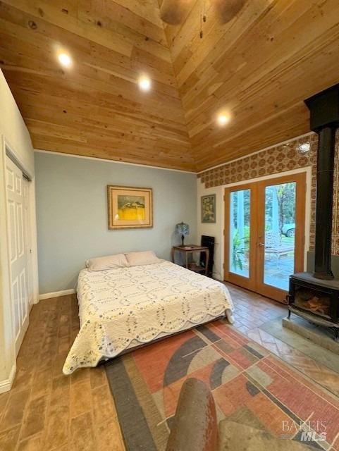 bedroom with access to outside, french doors, high vaulted ceiling, and wooden ceiling