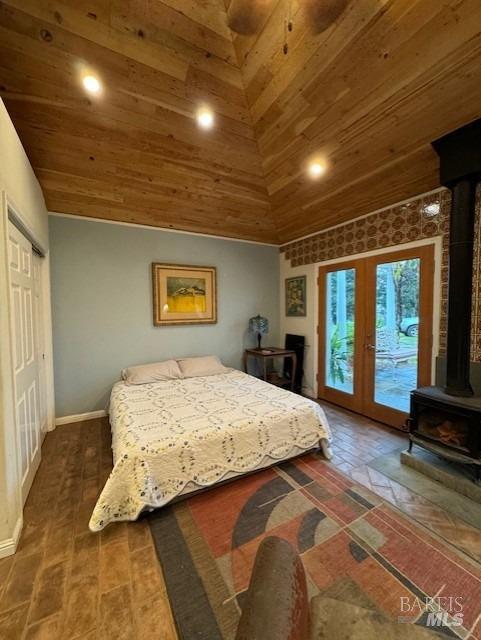 bedroom featuring french doors, access to outside, high vaulted ceiling, and wooden ceiling