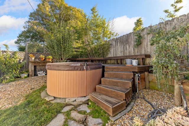 deck featuring a hot tub