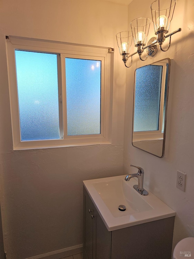 bathroom featuring vanity and an inviting chandelier