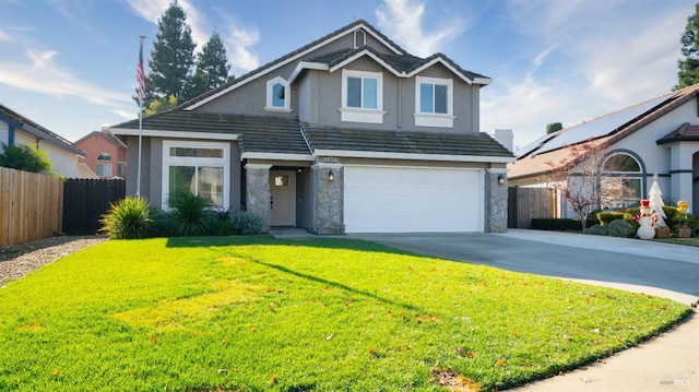 view of property featuring a garage and a front yard