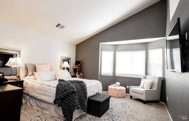 bedroom with light carpet and high vaulted ceiling