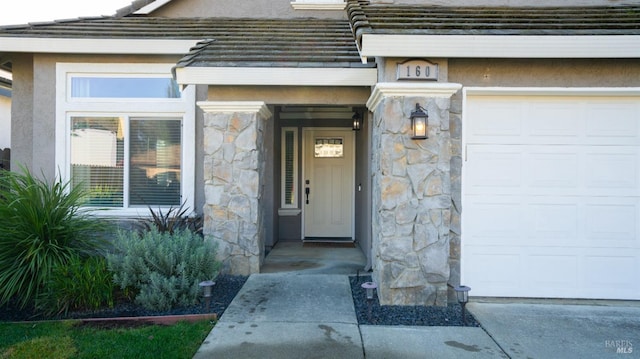 property entrance with a garage