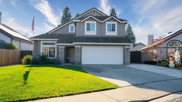 front of property featuring a front lawn and a garage