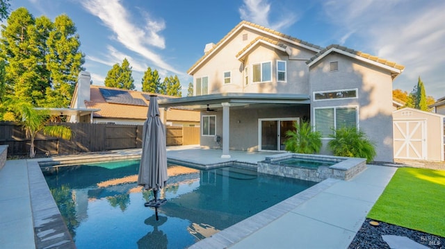 view of swimming pool with a patio, a fenced in pool, a fenced backyard, and a ceiling fan