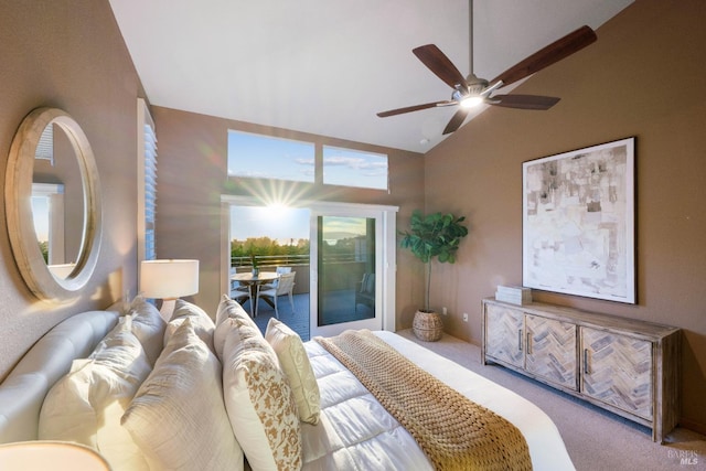 carpeted bedroom with ceiling fan, access to exterior, and high vaulted ceiling