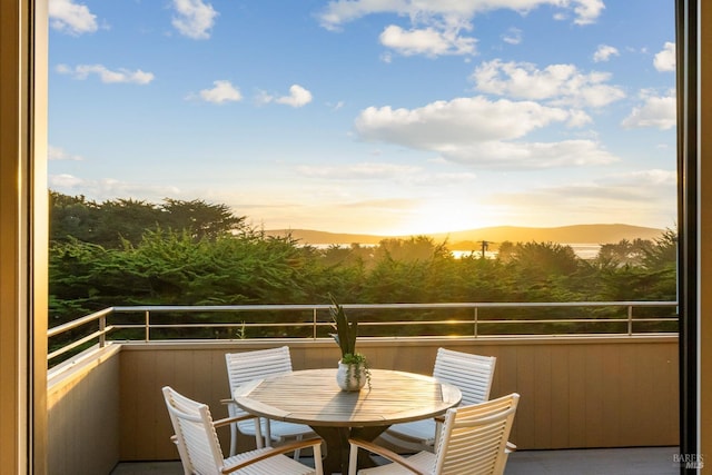 view of balcony at dusk