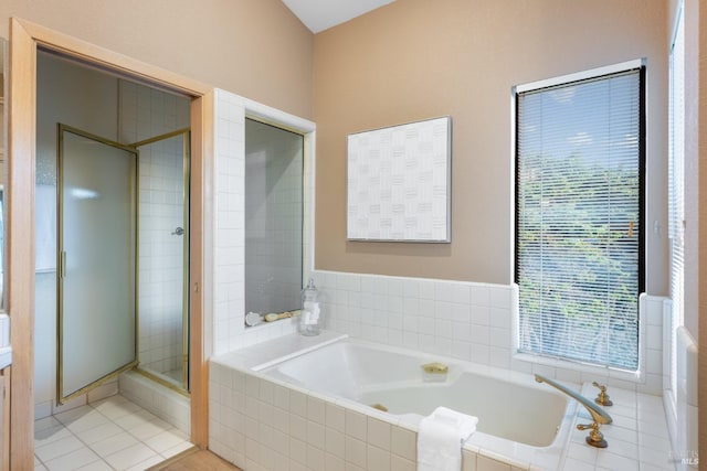 bathroom with tile patterned floors and plus walk in shower