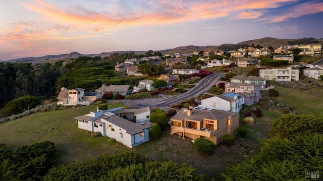 aerial view at dusk with a mountain view