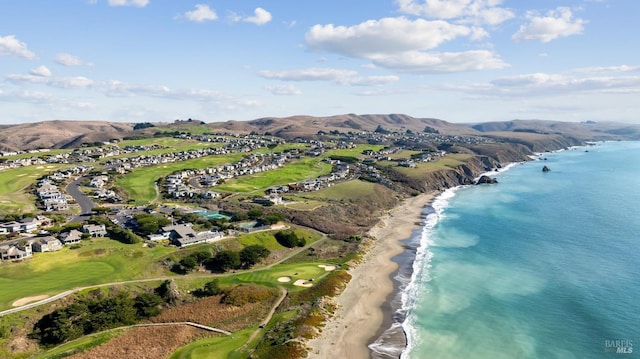 aerial view featuring a water and mountain view