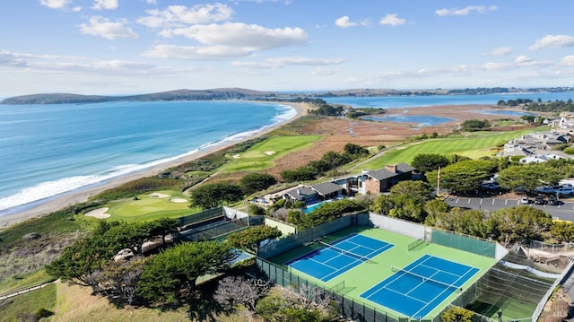 drone / aerial view featuring a water view and a beach view